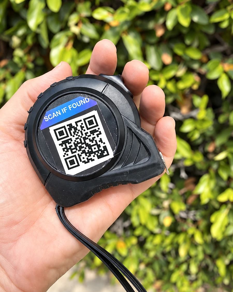 PackaTag QR recovery sticker attached to a tape measure